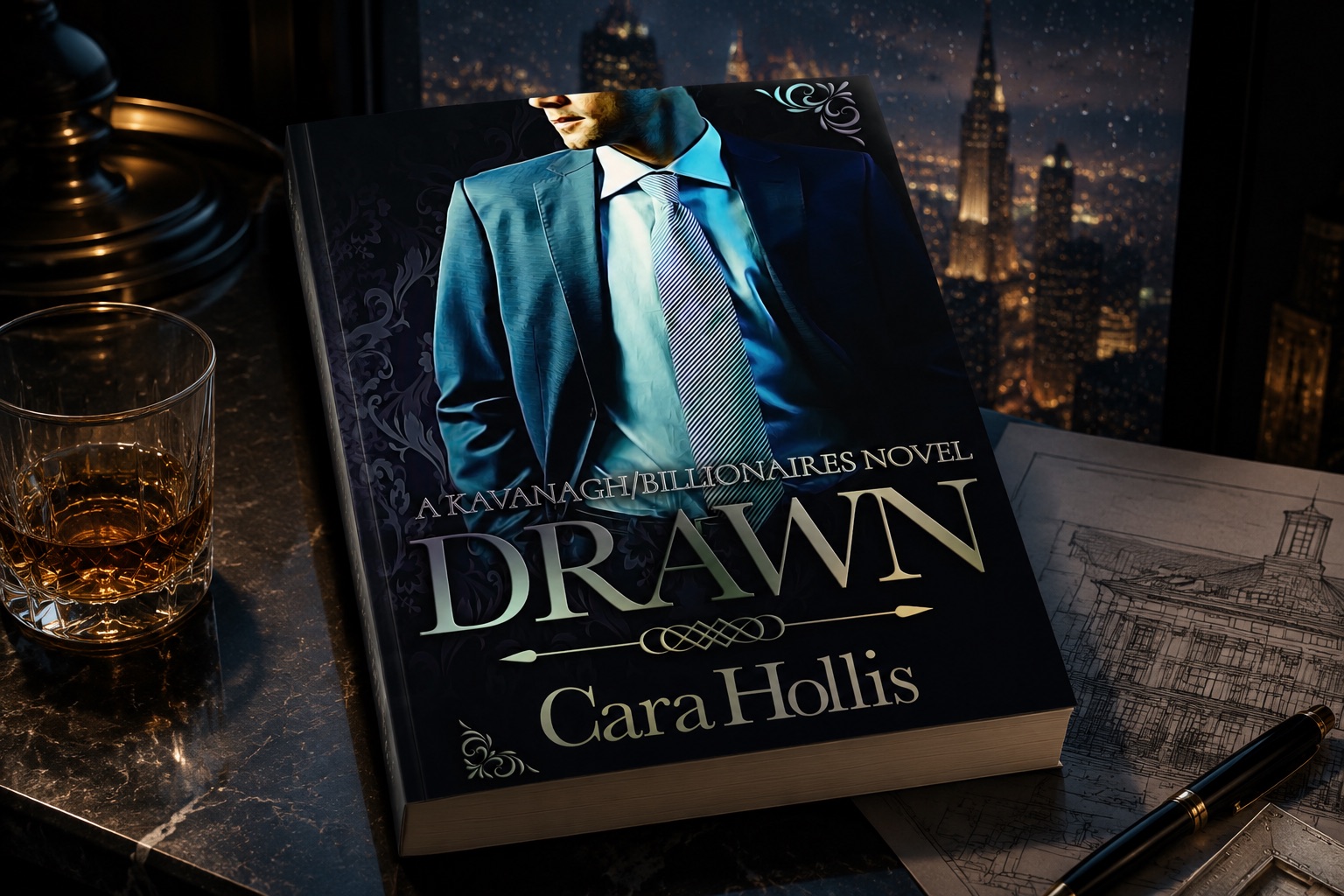 The book Drawn resting beside architectural blueprints and a glass of whiskey